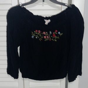 Black, off the shoulder top with floral embroidery. Size medium.